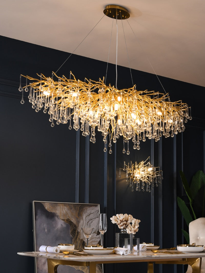 Lights of Scandinavia - ooze - "-What on earth is that majestic being hanging from the ceiling?"  Majestic crystal chandelier. Unique lighting for dining rooms, living areas, entrance halls, hotel areas, restaurants, etc.    K9 crystals with silver/gold metal plated aluminum frame. - A work of art.  2 sizes - 2 colors L120cm: L120xW50xH35cm, 12-25m2 L160cm: L160xW55xH35cm, 16kg, 15-30m2